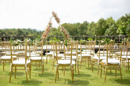 Beautiful and rustic garden wedding setup on a sunny day during summer.の写真素材