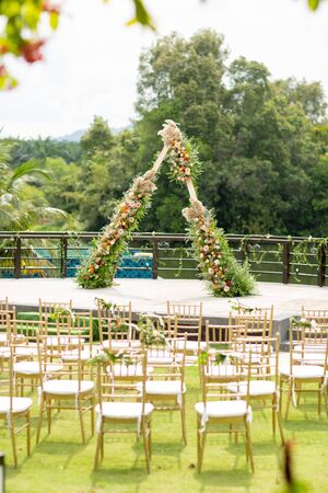 Beautiful and rustic garden wedding setup on a sunny day during summer.の写真素材