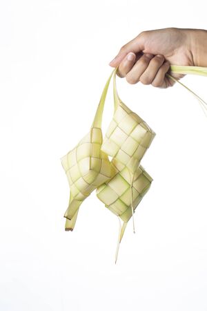 Ketupat (Rice Dumpling) On isolated Background. Ketupat is a natural rice casing made from young coconut leaves for cooking rice during eid Mubarak, Eid ul Fitrの写真素材