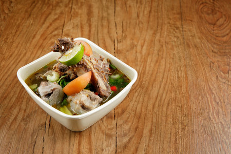 Delicious Beef soup shoot on wooden table. Malaysia beef soup.の写真素材