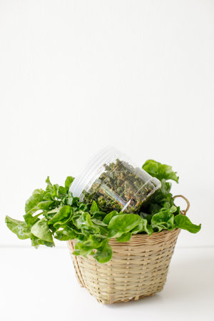 a bottle of fried brazilian spinach and a basket of brazilian spinach