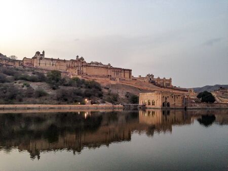 A shot of Amer Fort with its reflection in the lake taken in Jaipur, Rajasthan India.