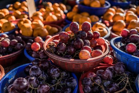 A shot of fresh grapes and oranges taken at a local market in Malaysia.