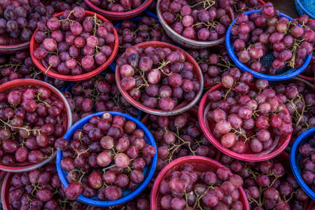 A shot of grapes in mini baskets taken at a local market in Johor Malaysia.の写真素材