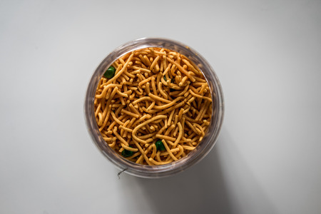 A top view shot of Malaysian traditional crispy snack in a glass containerの写真素材