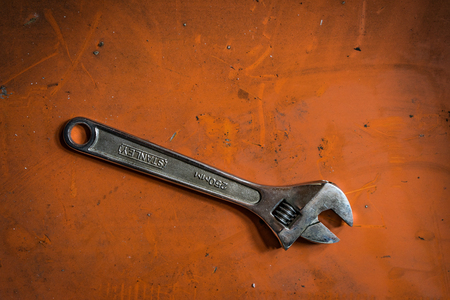 Shah Alam, Selangor Malaysia - May 12, 2016: A shot of an adjustable spanner on orange background.のeditorial素材