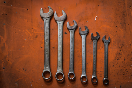 Shah Alam, Selangor Malaysia - May 12, 2016 : A shot of various sizes of wrenches on orange background.のeditorial素材