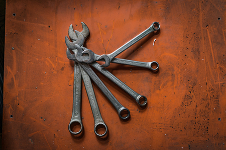 Shah Alam, Selangor Malaysia - May 12, 2016 : A shot of various sizes of wrenches on orange background.のeditorial素材