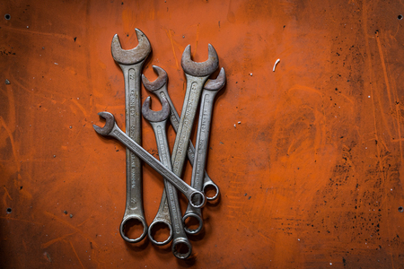 Shah Alam, Selangor Malaysia - May 12, 2016 : A shot of various sizes of wrenches on orange background.のeditorial素材