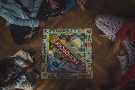 Fraser's Hill, Pahang Malaysia - August 13, 2016 : A top view shot of a family playing board game...