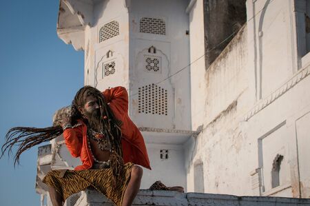 Jaipur, India : 16th February 2015 - Shot of an indian monk in traditional clothing tying his long hair.のeditorial素材