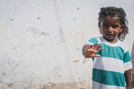 Pushkar, India : 17th February, 2015 - A shot of an Indian boy holding his hand up.のeditorial素材
