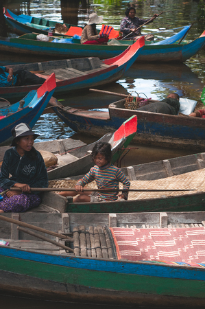 Siem Reap, Cambodia : October 5th, 2015 - Shot of local people doing business in their wooden boat at a local floating market in Siem Reap, Cambodiaのeditorial素材