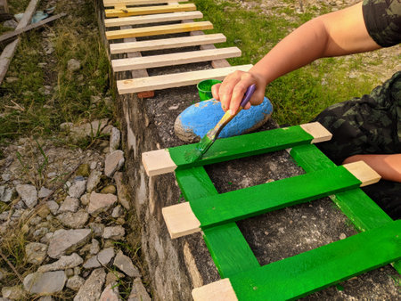 the work of painting wood with green paintの写真素材