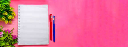 object with flowers decoration on soft pink background. with the theme of back to school during a pandemic. perfect for cover and banner concepts. copy space, flat lay, top view.の写真素材