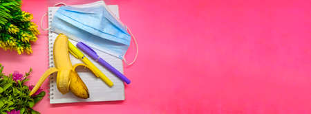 object with flowers decoration on soft pink background. with the theme of back to school during a...