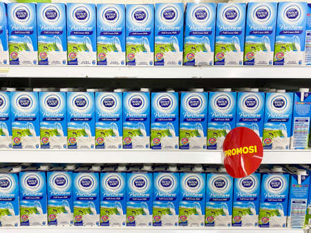 Kuala Lumpur, MALAYSIA - 7 June 2020: Dutch Lady Pure Farm Full Cream Milk. Dutch Lady Milk Industries Berhad is a manufacturer of cow milk and dairy products in Malaysia since the 1960s.のeditorial素材