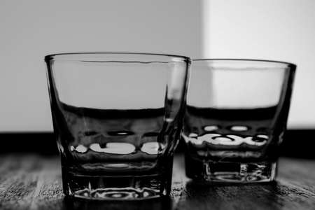 Black and white closeup photo of a glass beaker