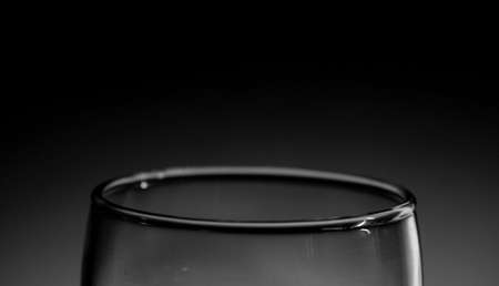 Black and white closeup photo of a glass beakerの写真素材