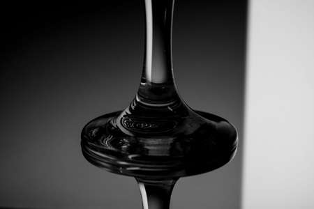 Black and white closeup photo of a glass beakerの写真素材