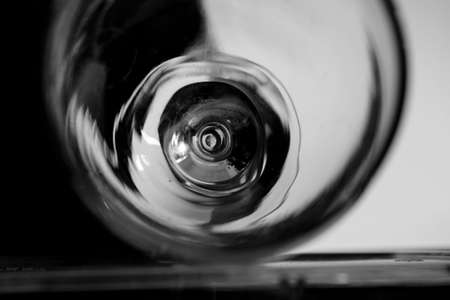 Black and white closeup photo of a glass beaker