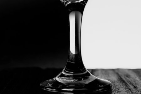 Black and white closeup photo of a glass beaker
