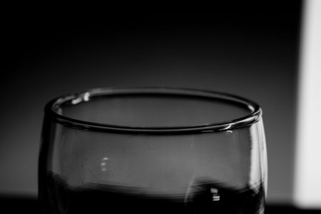 Black and white closeup photo of a glass beakerの写真素材