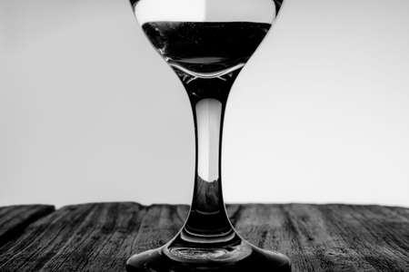Black and white closeup photo of a glass beaker