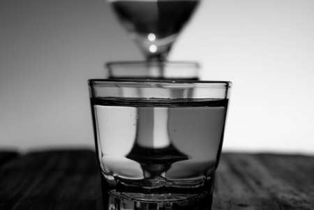 Black and white closeup photo of a glass beaker