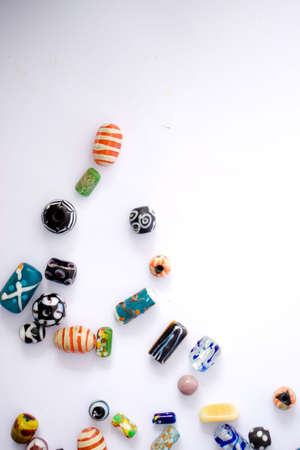 Photo of colorful beads on a white backgroundの写真素材
