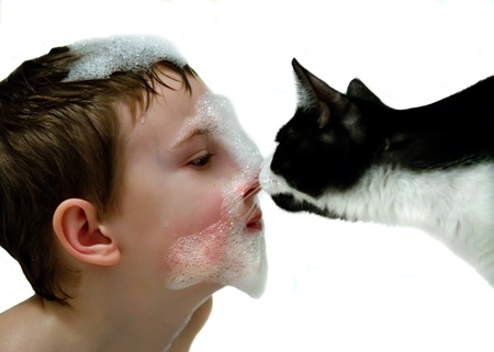 boy and cat in the bathの写真素材