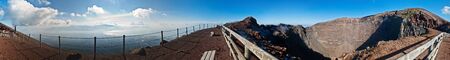 panorama at crater of volcano Vesuvio, seen crater inside and bay of Naples