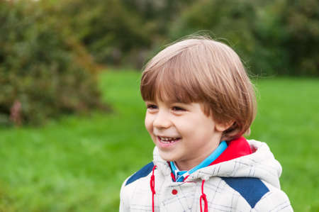 Adorable boy smiling outdoorsの写真素材