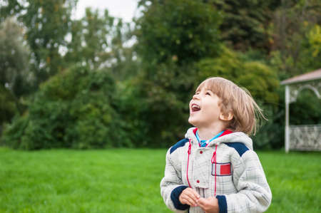 Adorable boy smiling outdoorsの写真素材