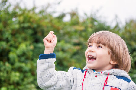 Adorable boy smiling outdoors