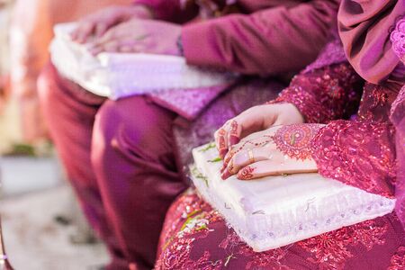 Very beautiful and unique henna paintings are on both hands of the bride.