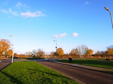 Sub-urban roundabout under the Autumn skyの写真素材