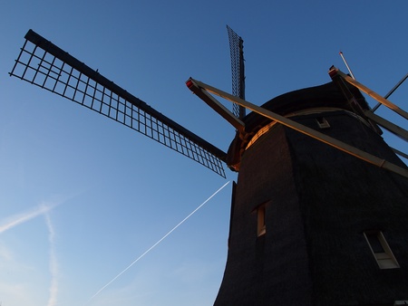 Amsterdam traditional windmill under the blue sky