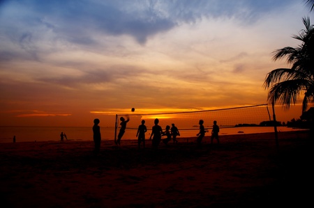 volleyball game player at silhouette の写真素材