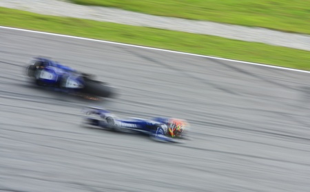 SEPANG, MALAYSIA - OCTOBER 21: Motion blur Katsuyuki Nakasuga from Yamaha Factory Racing fell while...