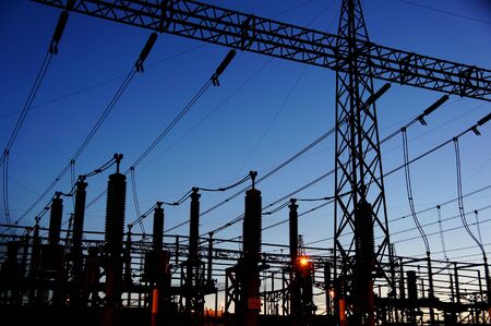 electrical substation silhouette on blue sky