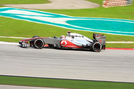 SEPANG, MALAYSIA - MARCH 24: Jenson Button of McLaren-Mercedes taking corner during third practice session at Petronas Formula 1 Grand Prix on March 24, 2012 in Sepang, Malaysiaのeditorial素材