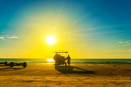 fisherman at work during great sunriseの写真素材