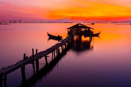 colorful sunrise with tradional fisherman jettyの写真素材