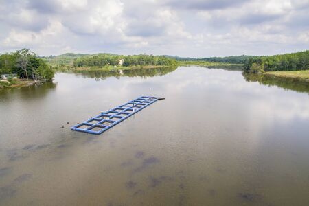 aerial view traditional fish cage in shallow waterの写真素材