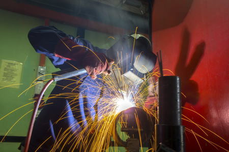 welder at work with fire blazeのeditorial素材
