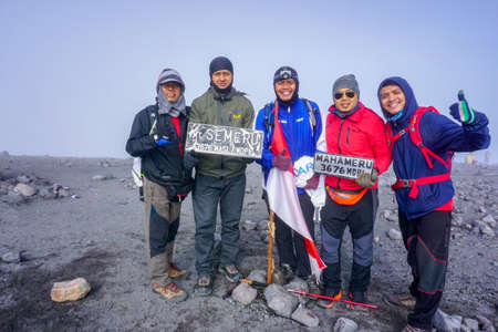 Bromo Tengger Semeru National Park, East Java, Indonesia, December 24, 2017: A group of climbers posed together as they celebrated their success at the summit of Mount Semeru in Indonesiaのeditorial素材