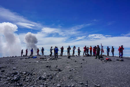 Bromo Tengger Semeru National Park, East Java, Indonesia, December 24, 2017: A group of climbers posed together as they celebrated their success at the summit of Mount Semeru in Indonesiaのeditorial素材
