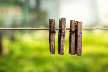 Wooden pins on ropeの写真素材