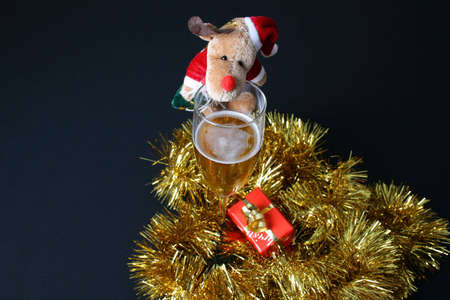 Christmas drink with decorations and a small giftの写真素材